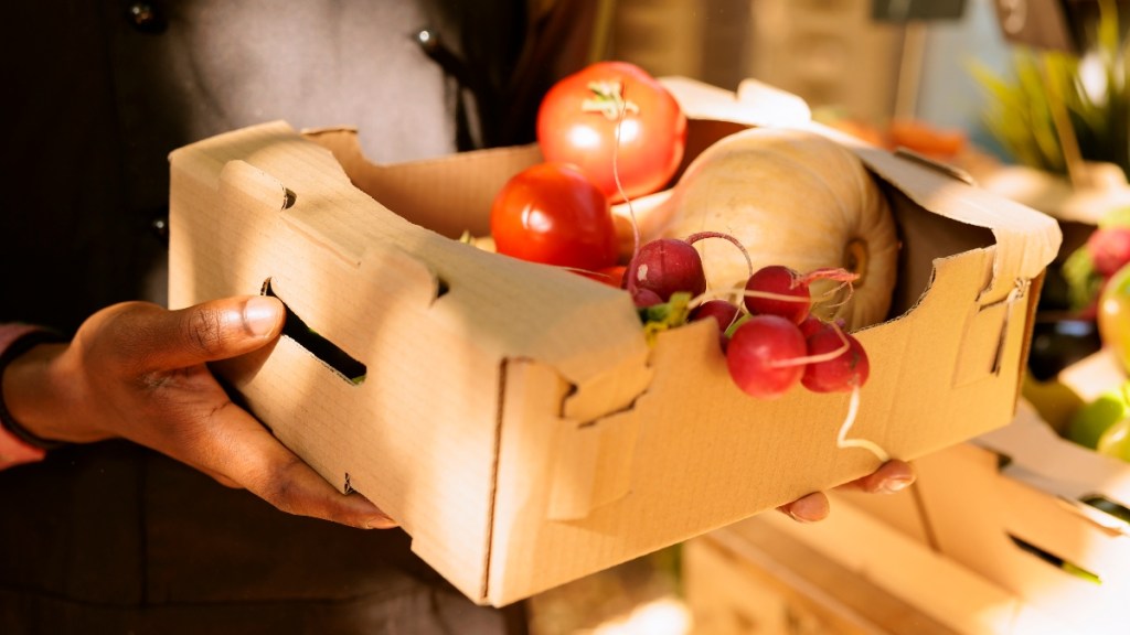 A box holding farmers market produce