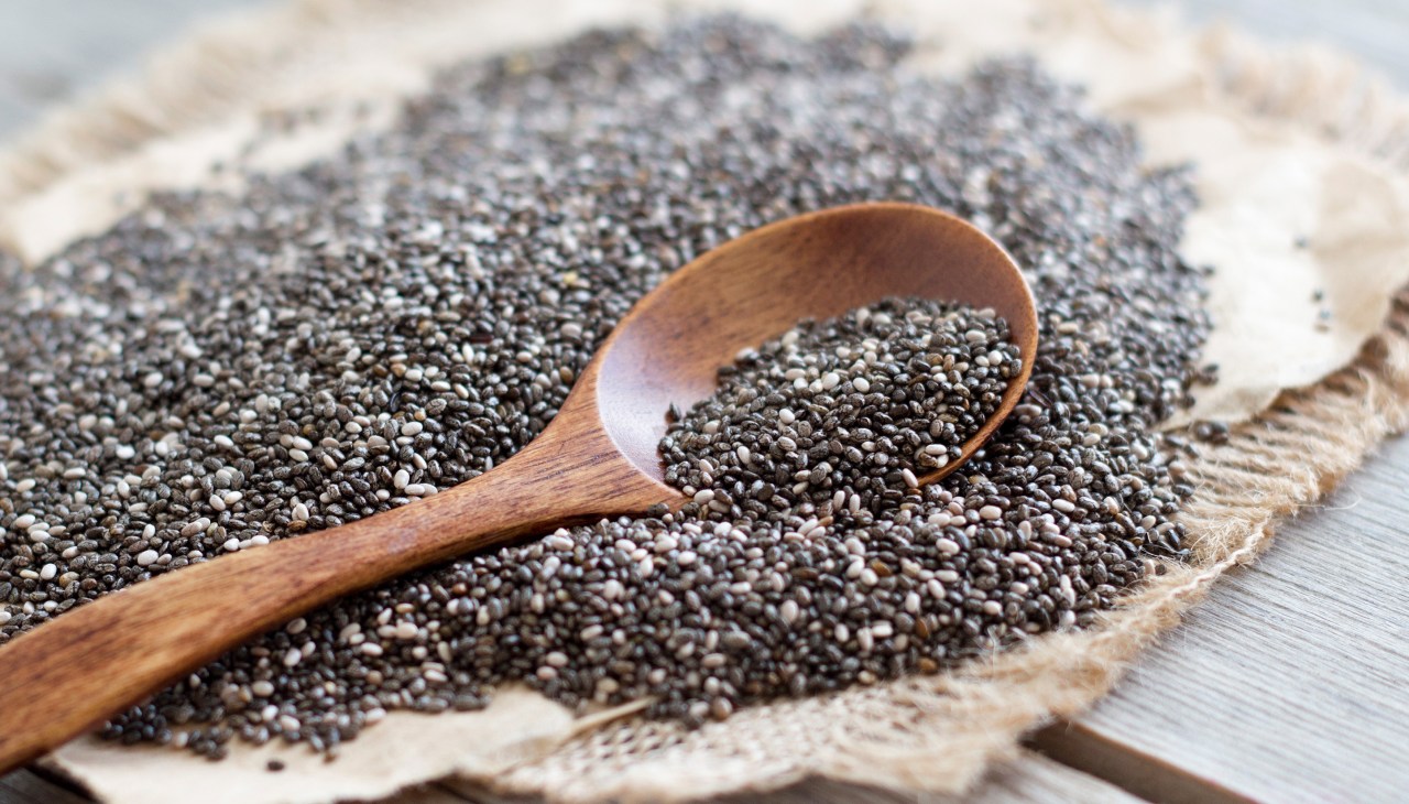 close up of chia seeds and a wooden spoon