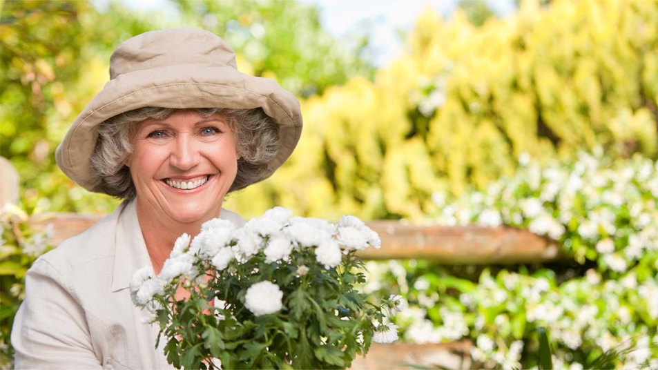 Smiling woman in her garden