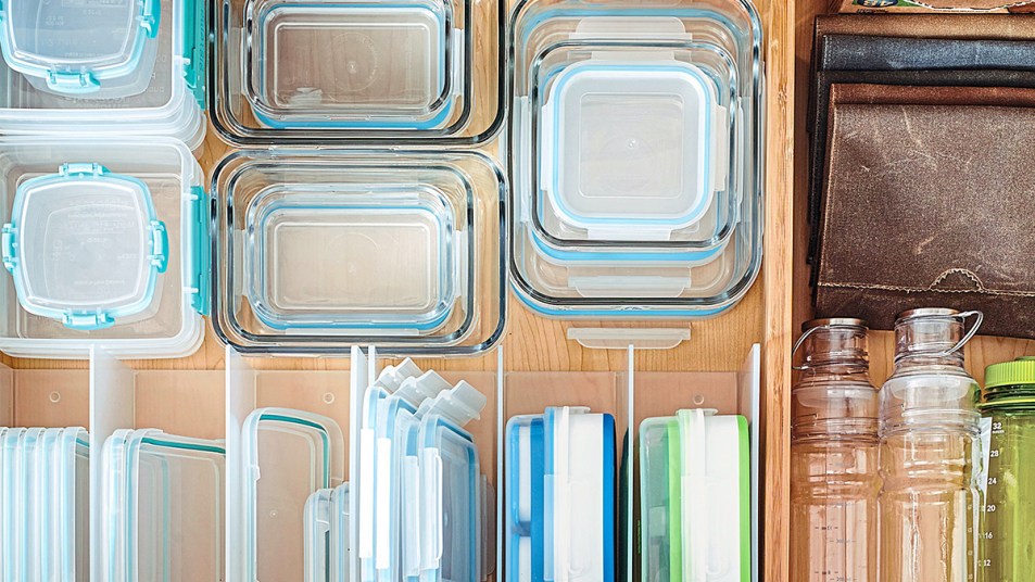 Super simple way to organize Tupperware lids - napkin holders from