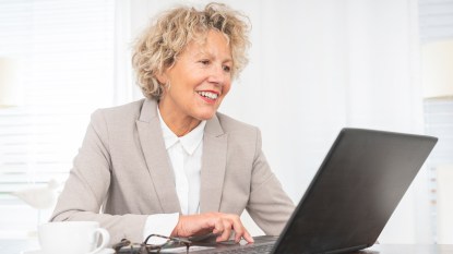 Woman on her computer applying for jobs