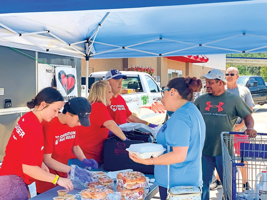 People thank Operation BBQ Relief workers with tears in their eyes