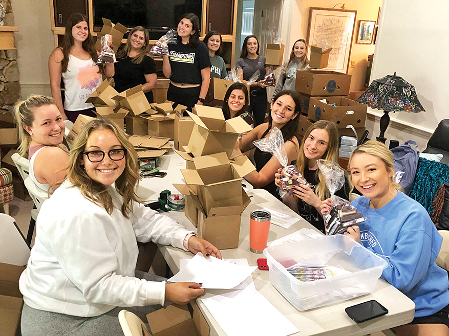 Volunteers count, sort, box and package the lipsticks to send out