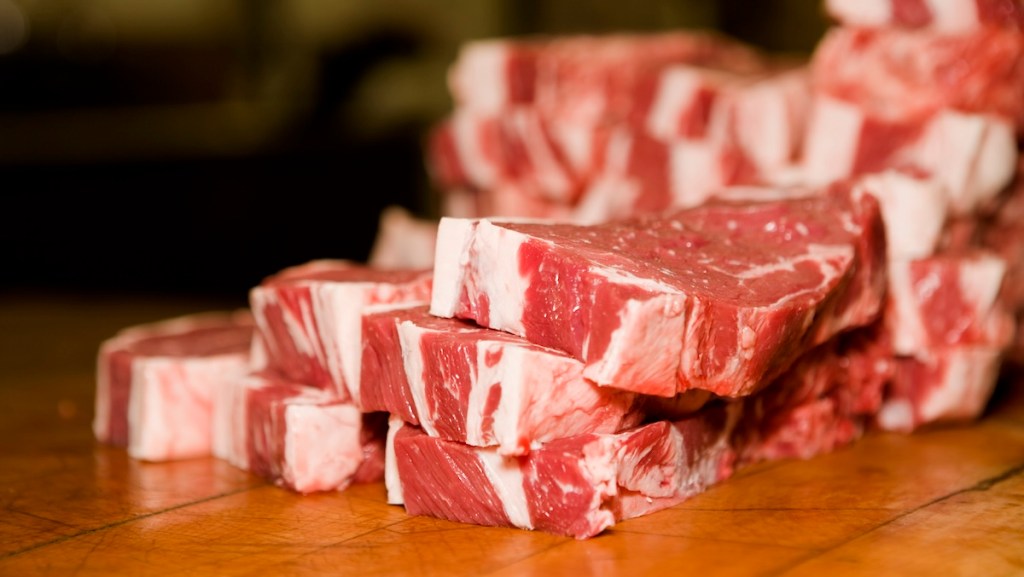 A pile of raw steaks