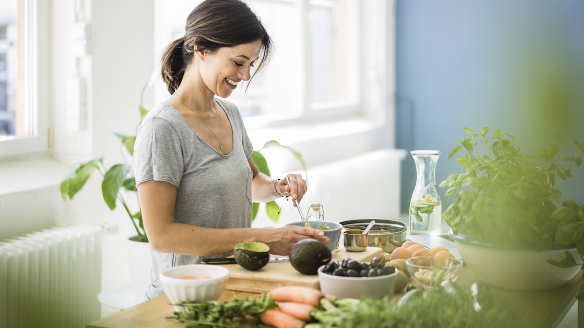 Woman preparing vegetables in her kitchen