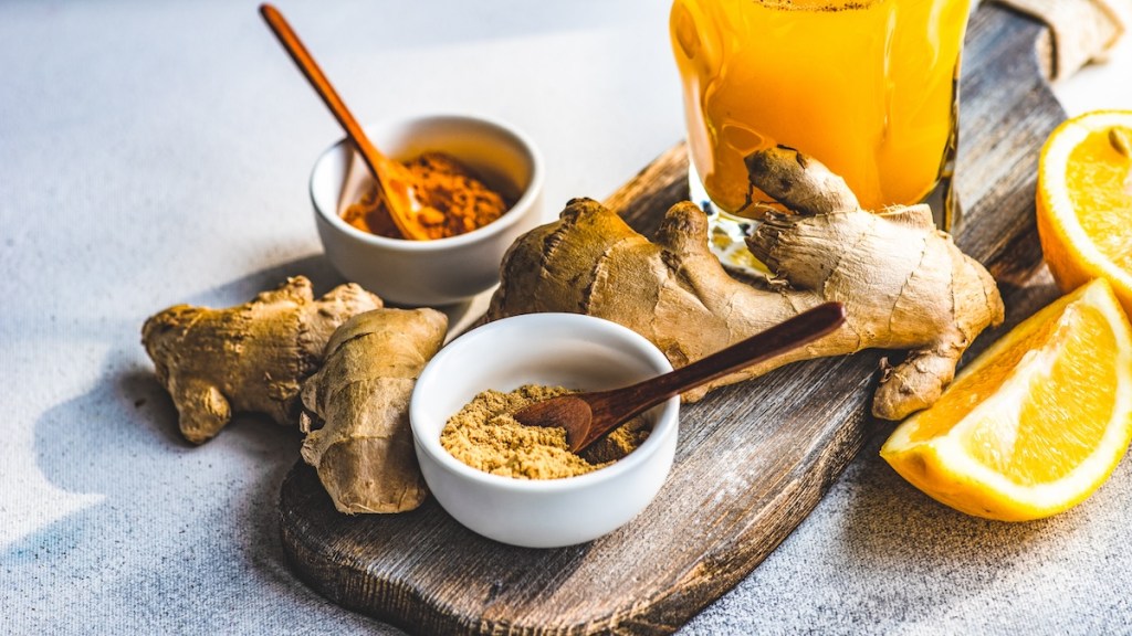 tumeric and ginger on wooden board