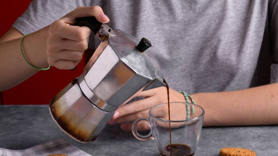 Woman pouring a cup of coffee