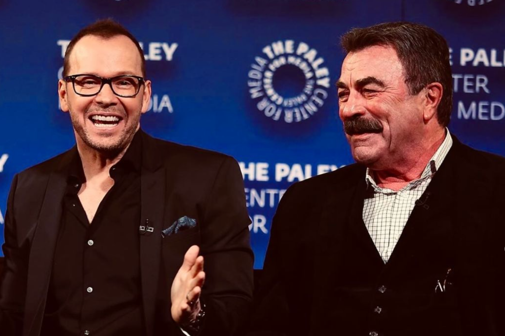 two men smiling and laughing; blue bloods cast get along