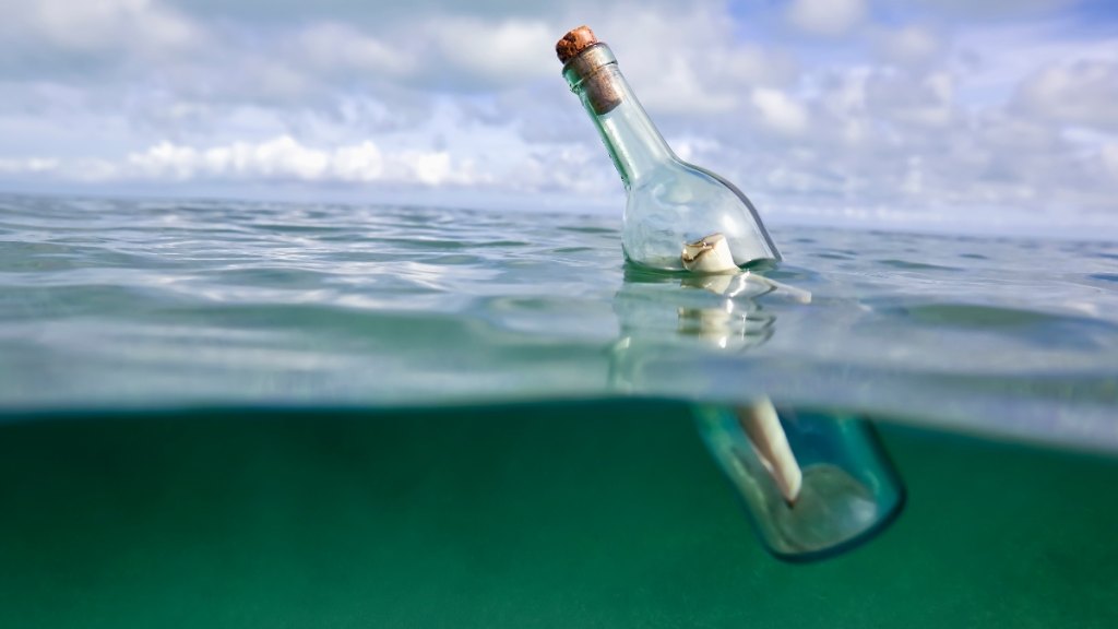 A message in a bottle floating in water