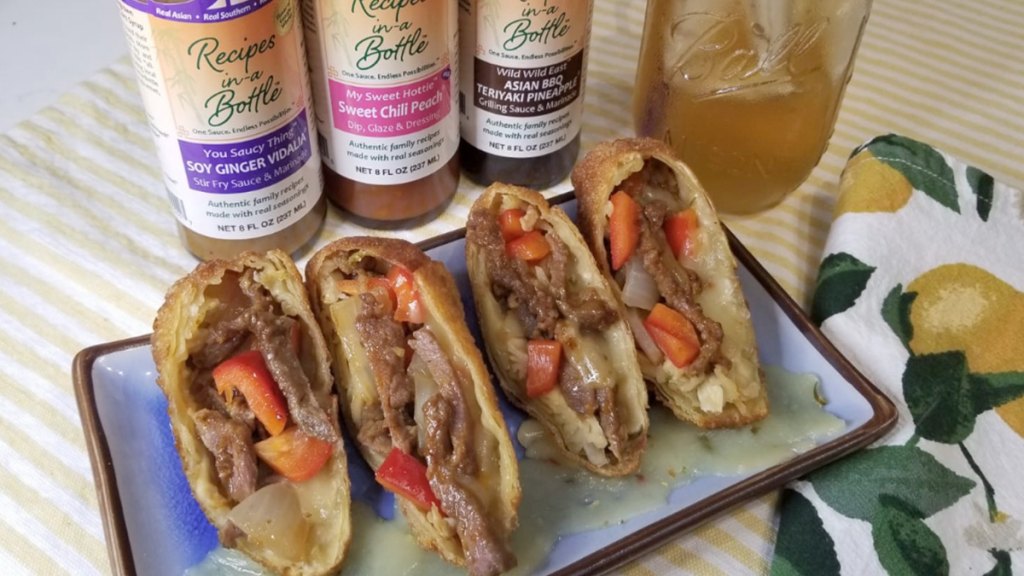 Cheesesteak egg rolls served on a platter