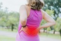 Woman with back pain when walking