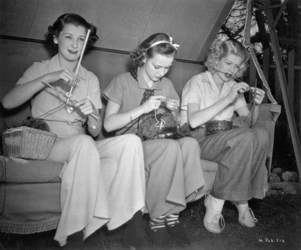 (Original Caption) Patricia Wilder, Anne Shirley, and Lucille Ball, (left to right), are the three young ladies studiously applying themselves to their "knit one purl one" between scenes on the RKO Radio lot in Hollywood.