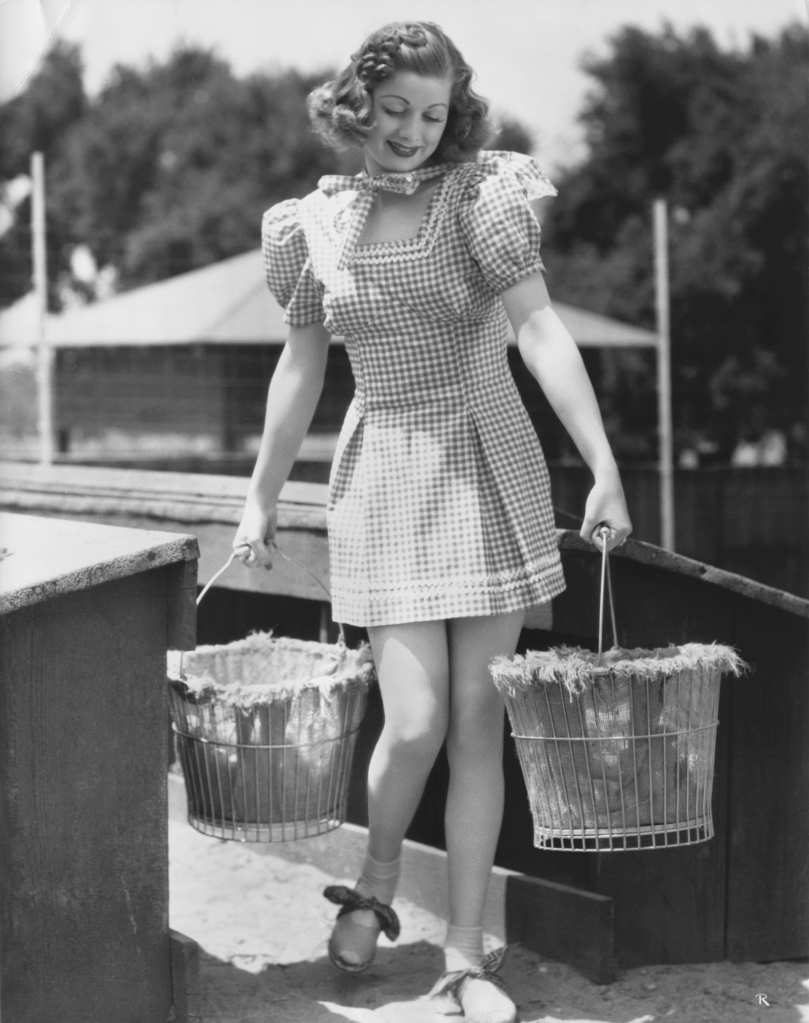 Lucille Ball collecting eggs — another one designer to get her picture in the papers?