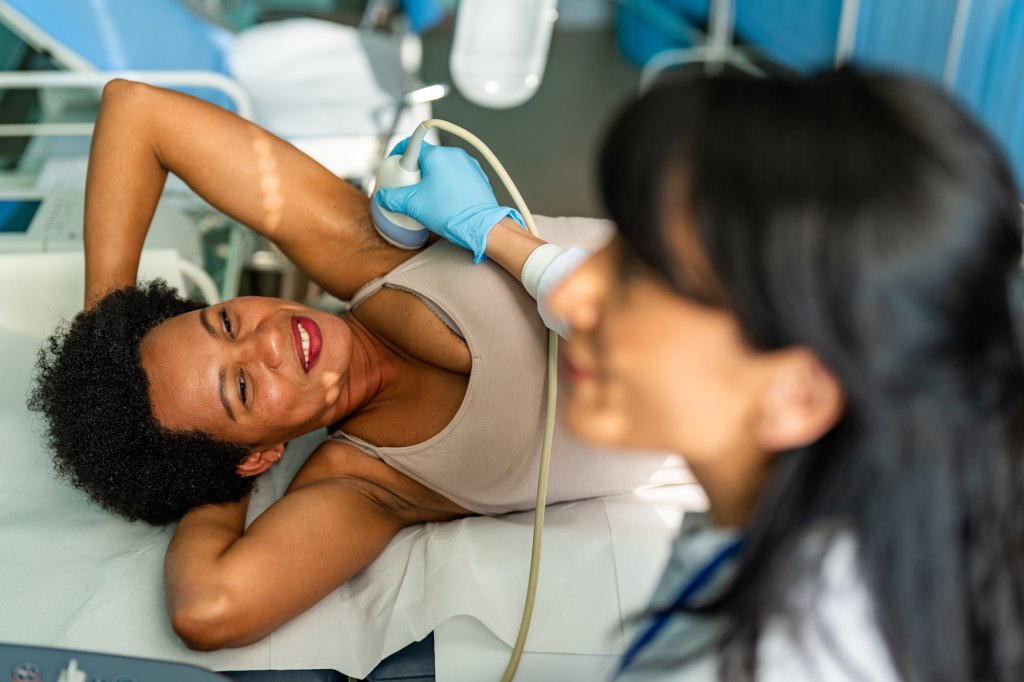 mature woman with dense breast tissue getting a breast ultrasound