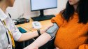 Woman getting blood pressure test