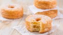 A slice into a homemade croissant doughnut