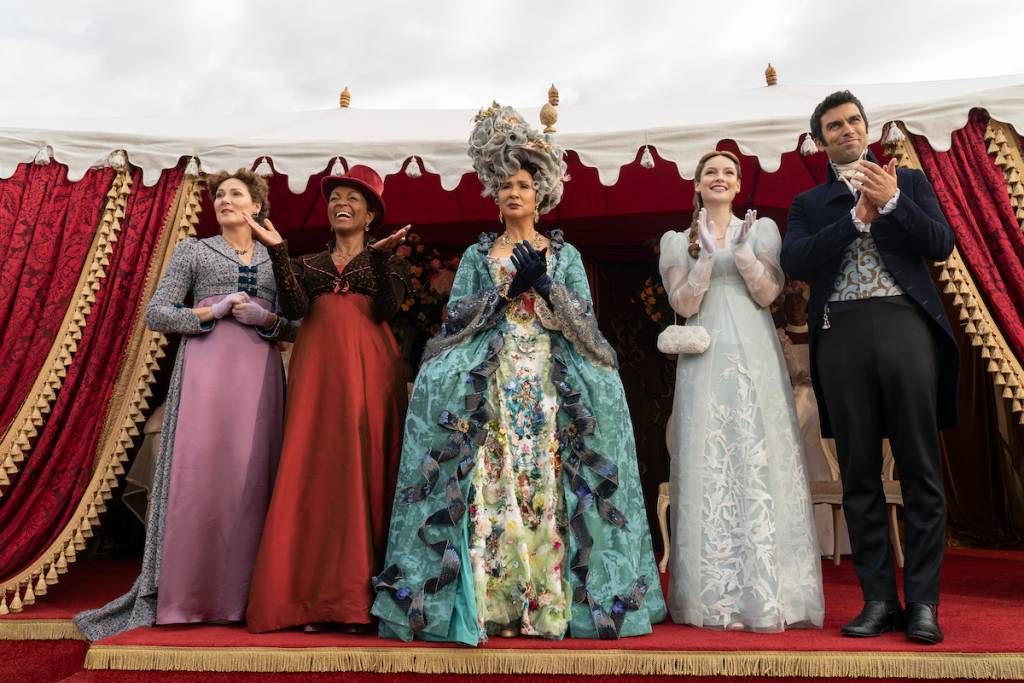 (L to R) Ruth Gemmell as Lady Violet Bridgerton, Adjoa Andoh as Lady Agatha Danbury, Golda Rosheuvel as Queen Charlotte, Hannah Dodd as Francesca Bridgerton, David Mumeni as Lord Samadani in episode 303 of Bridgerton