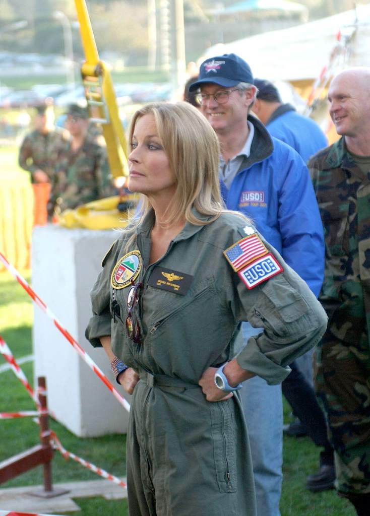 Bo Derek preparing to go onstage during a USO Holiday Entertainment tour in 2001 Memorial Day quotes
