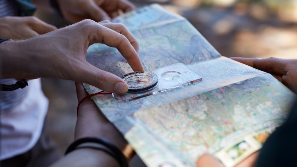 A hiker looking at a paper map