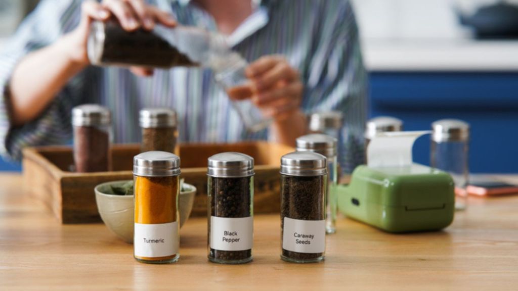 mature woman organizing spices on a kitchen countertop