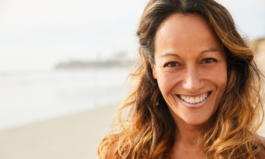 mature woman on the beach outside