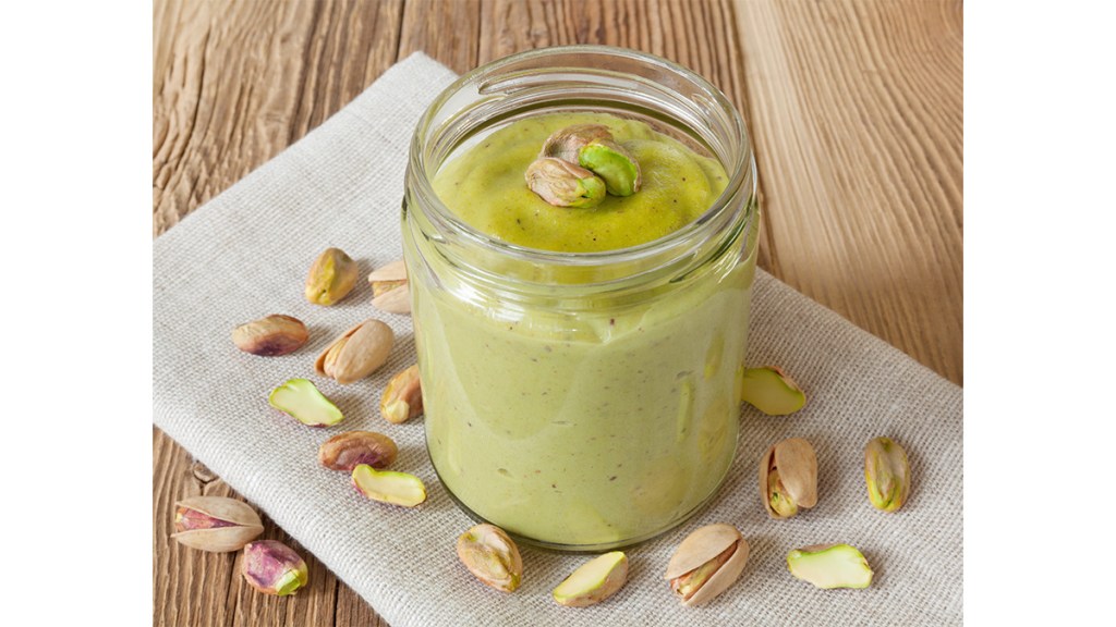 Pistachio butter in a jar as part of a guide on making pistachio ice cream