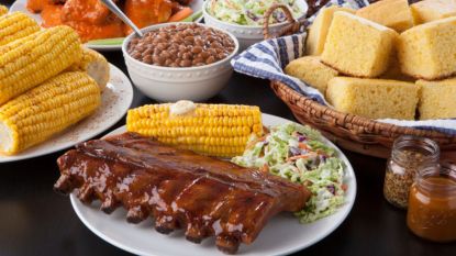 'Yellowstone' inspired recipes on table including ribs, baked beans and corn bread