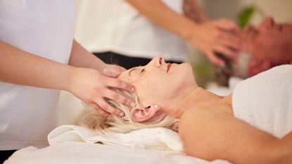 mature woman getting a scalp massage