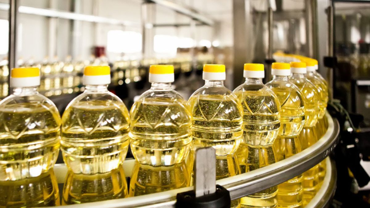 cooking oil bottles on conveyor belt