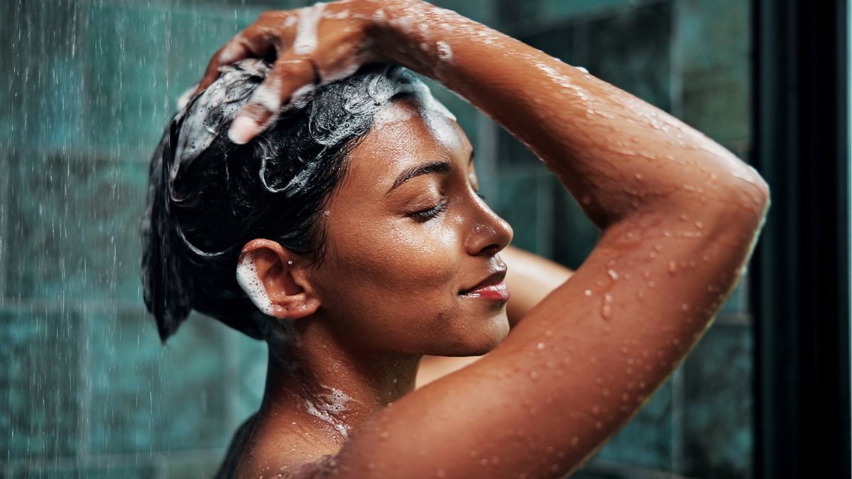 A woman washing her hair during an everything shower
