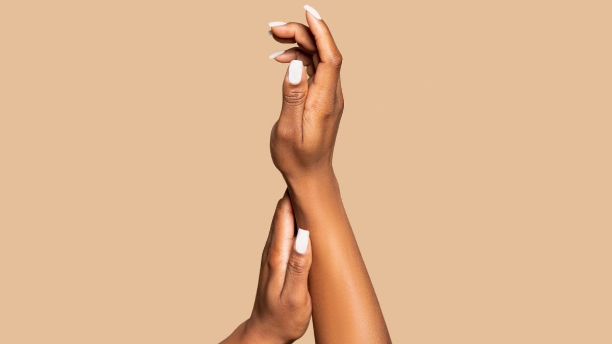 Close-up of woman's hands with a manicure after strengthening her weak nails